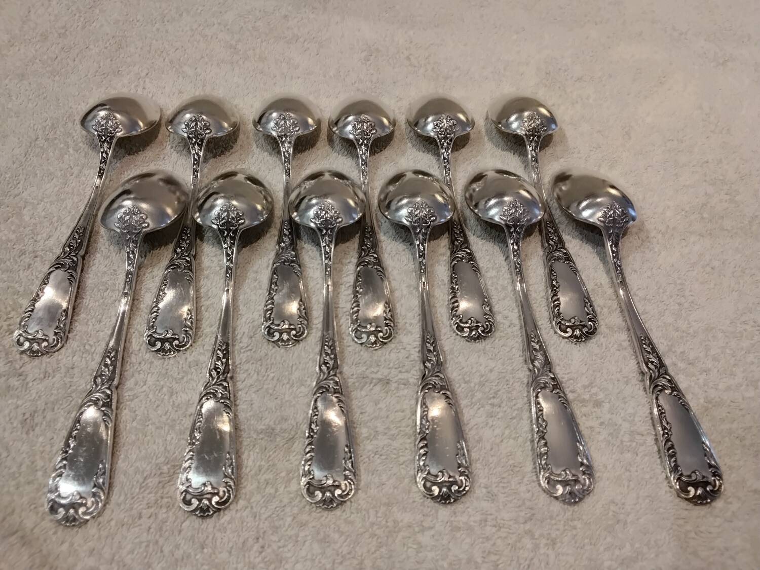 12 silver-plated metal dessert spoons, silversmith SFAM, rocaille design, 19.1 cm.