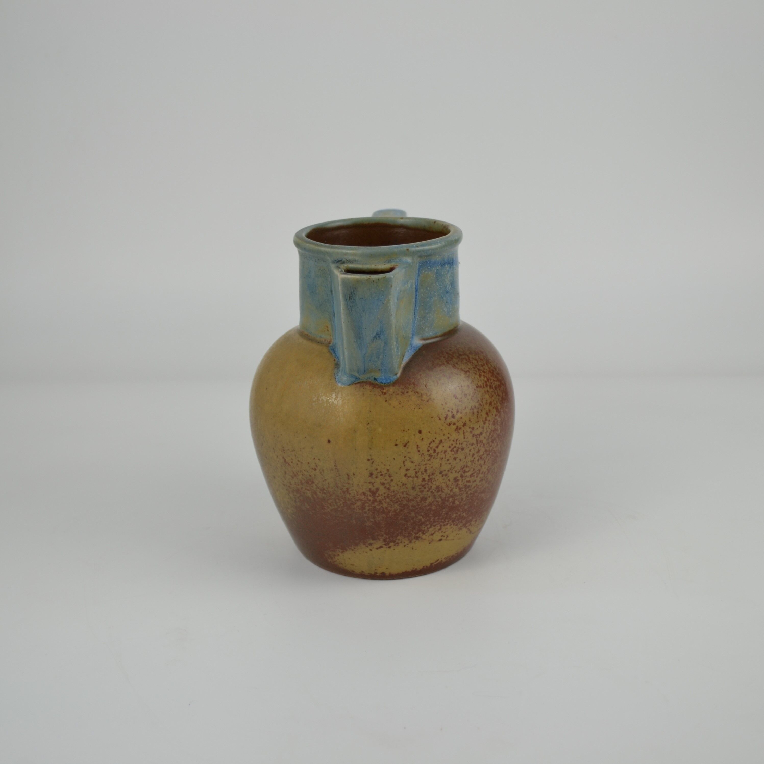 Two-tone stoneware pitcher by Louis Lourioux