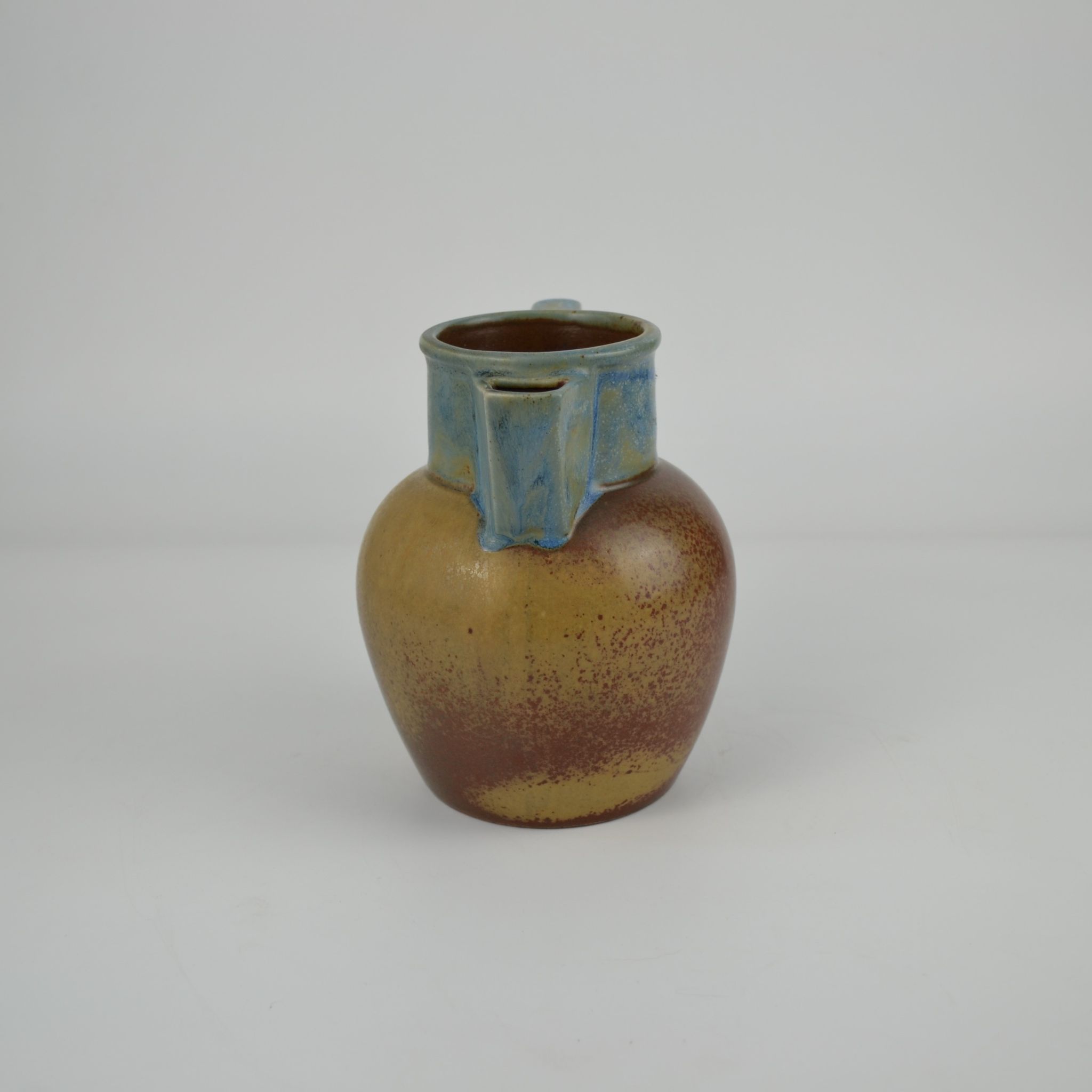 Two-tone stoneware pitcher by Louis Lourioux