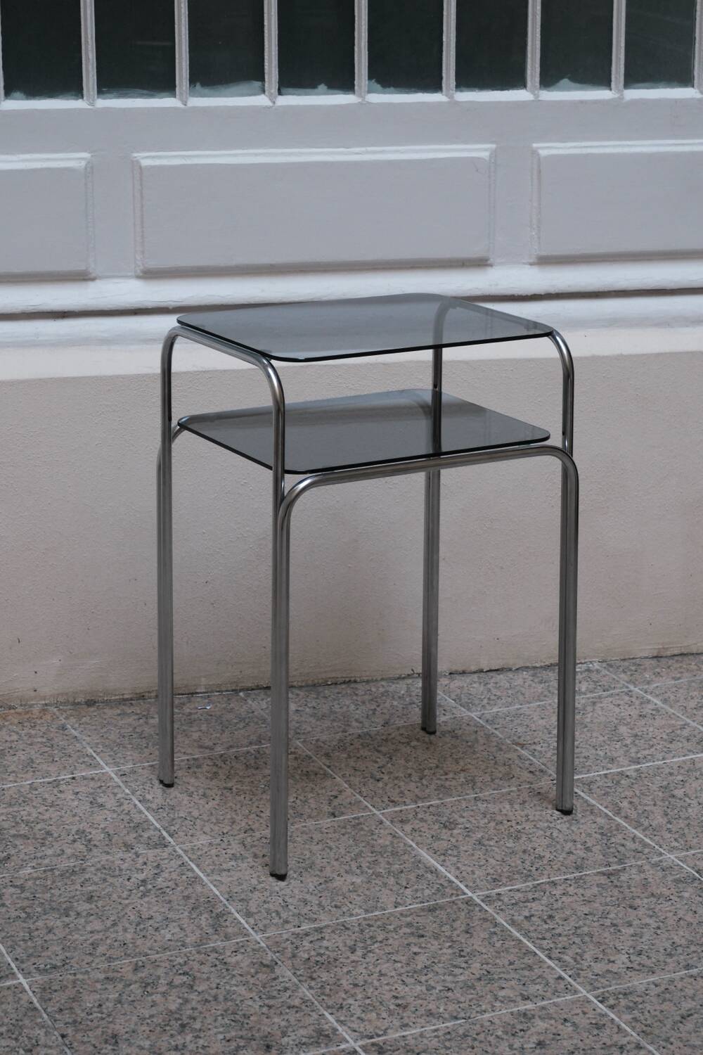 Vintage side table in smoked glass and chromed metal – 70s