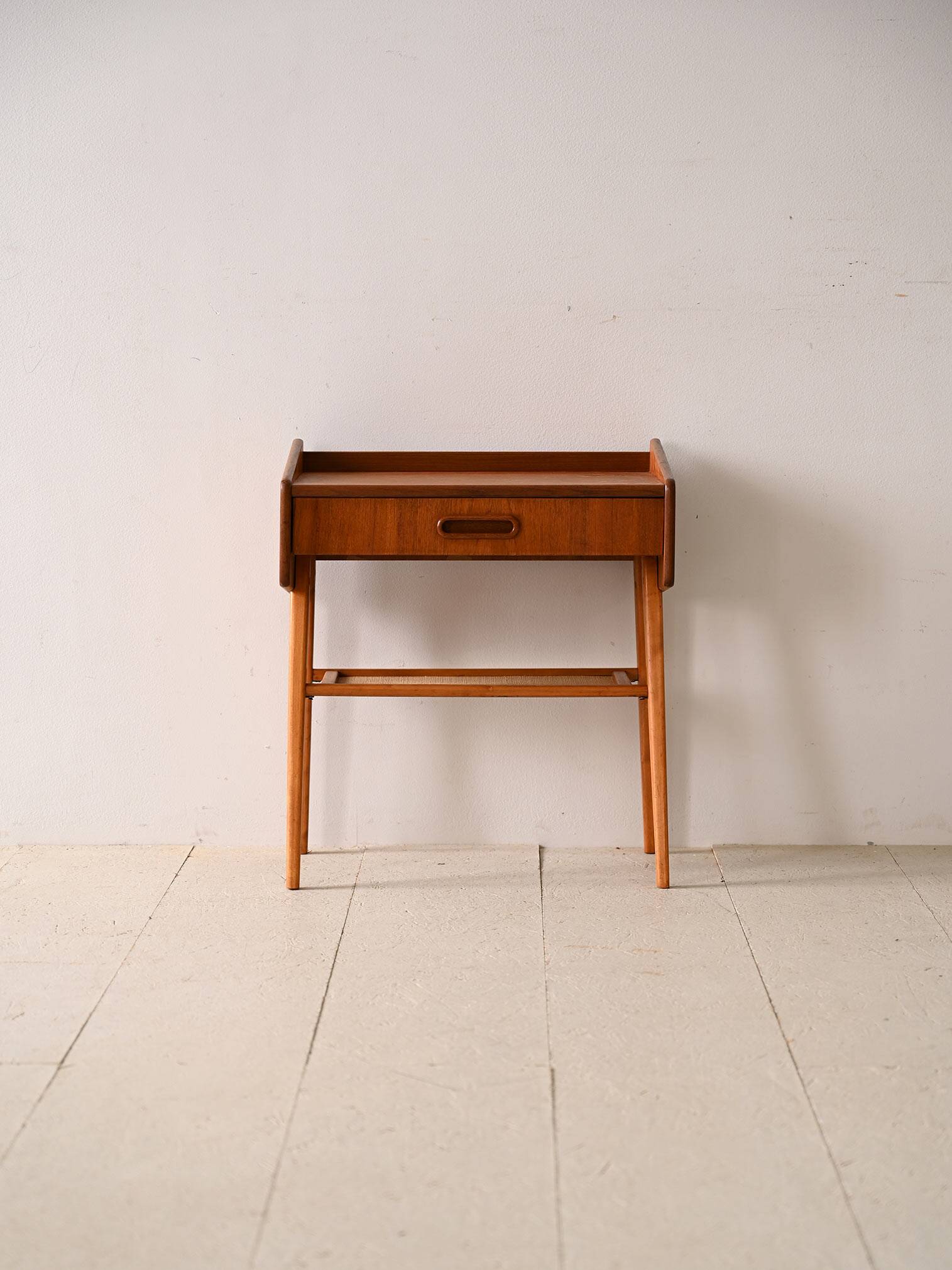 Bedside table with rattan magazine rack