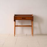 Bedside table with rattan magazine rack