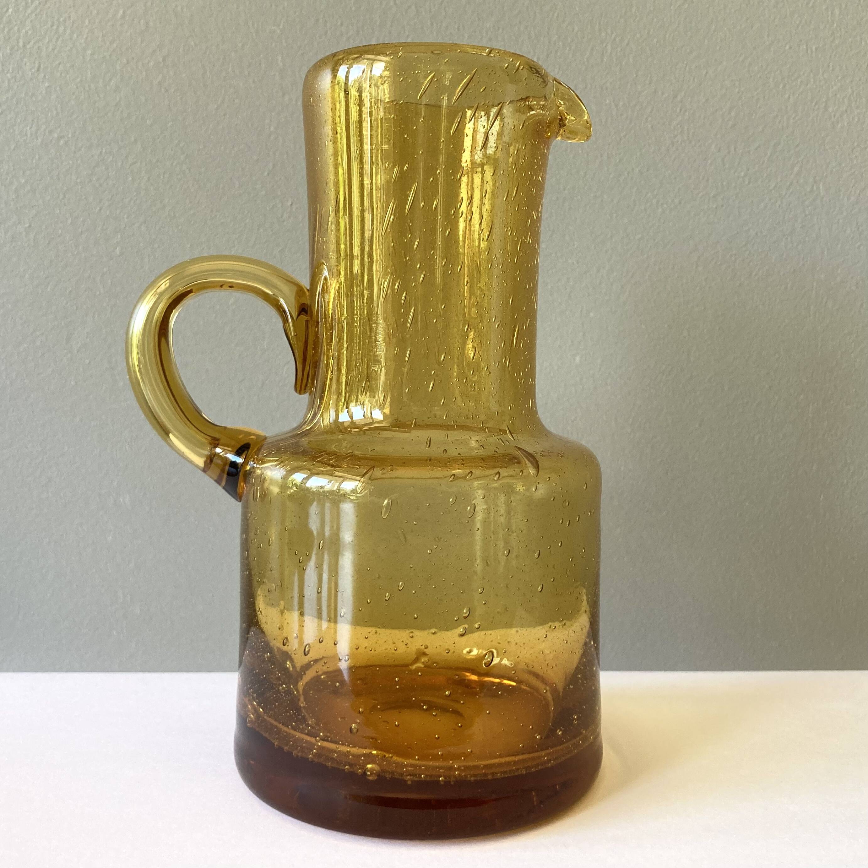 Vintage pitcher or jug forming a vase in amber and bubbled glass in the style of Biot glassware