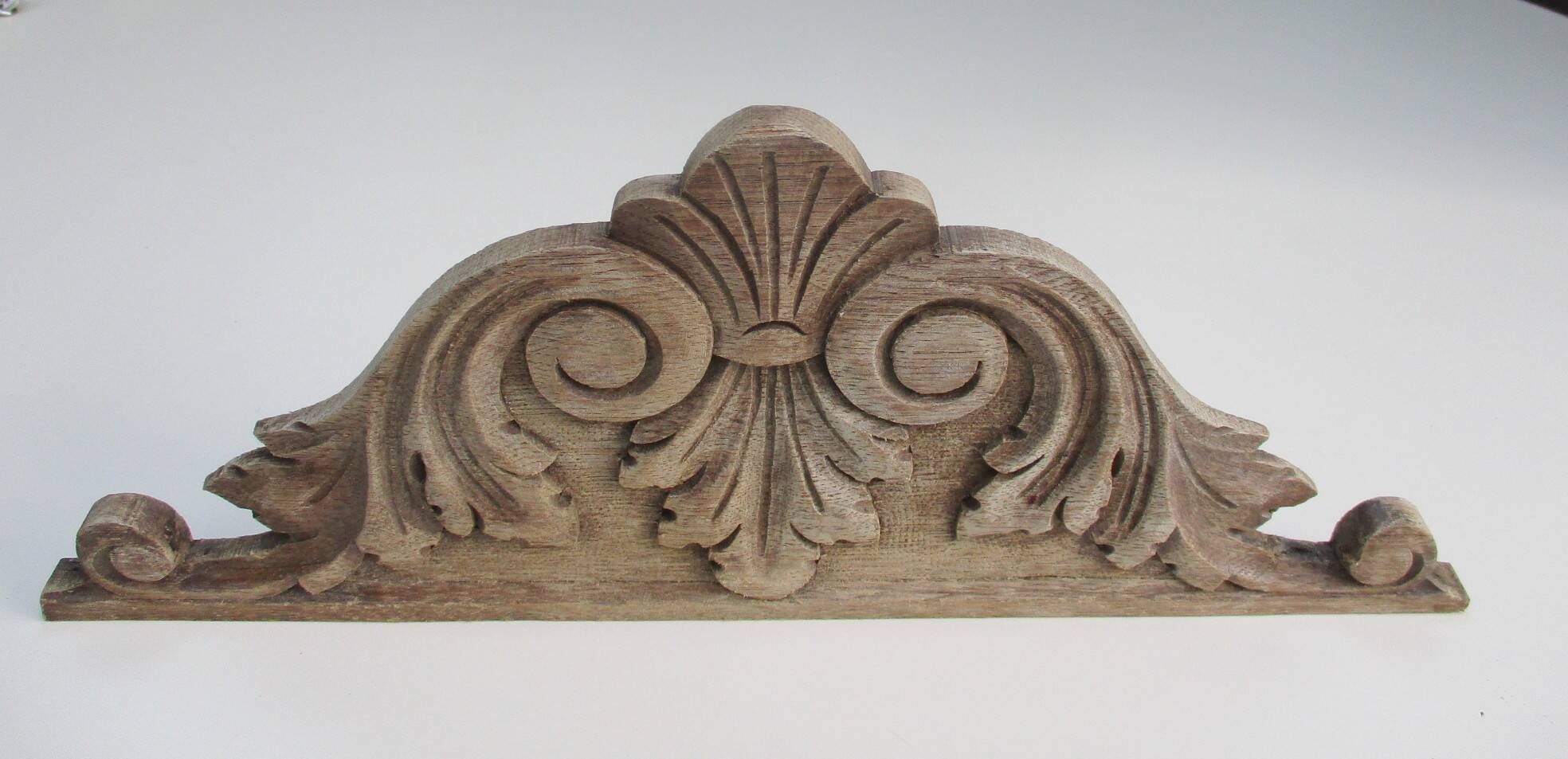 Old carved wooden pediment
