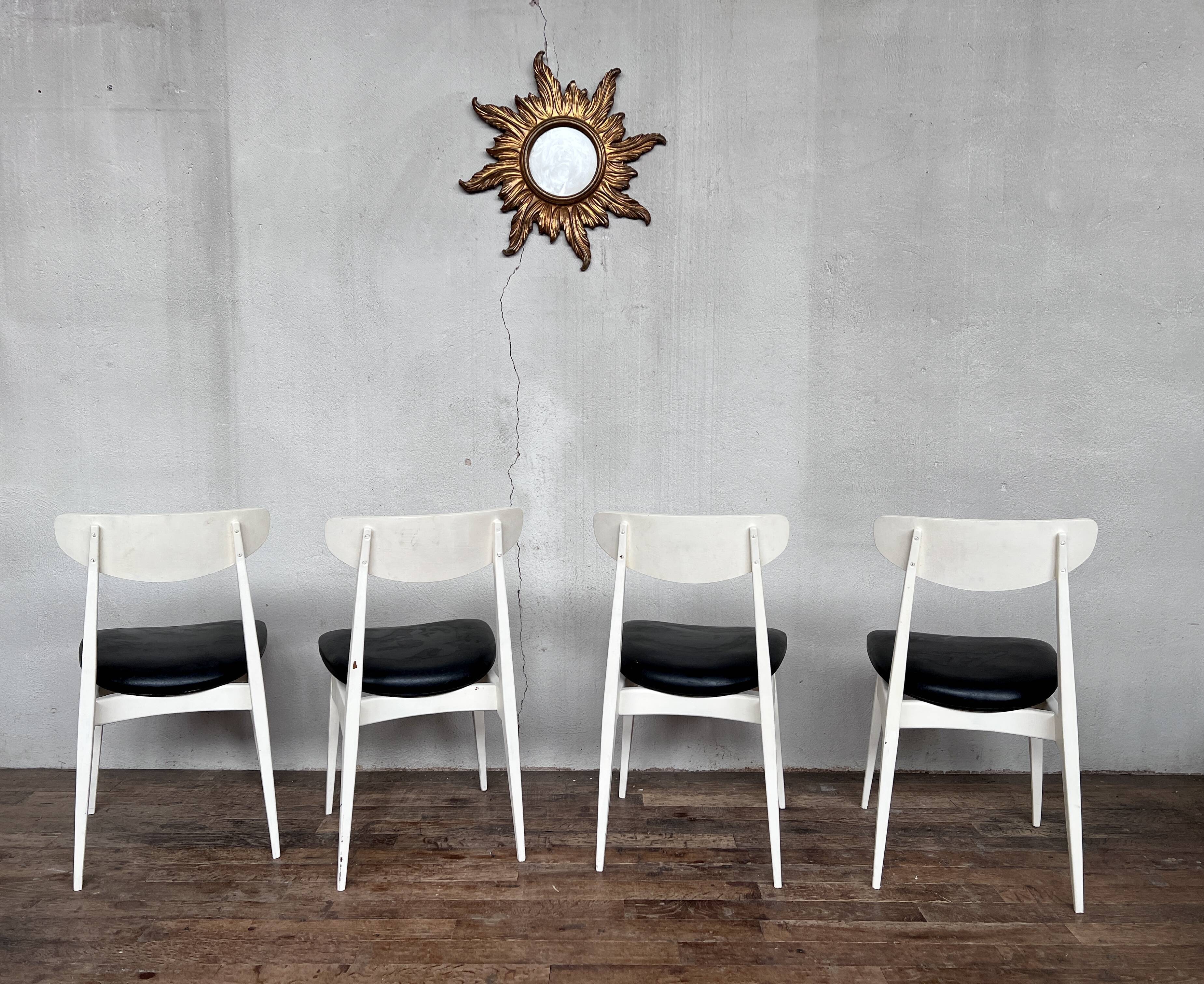 Series of 4 white and black Scandinavian chairs Ingrid from Stella 1960.