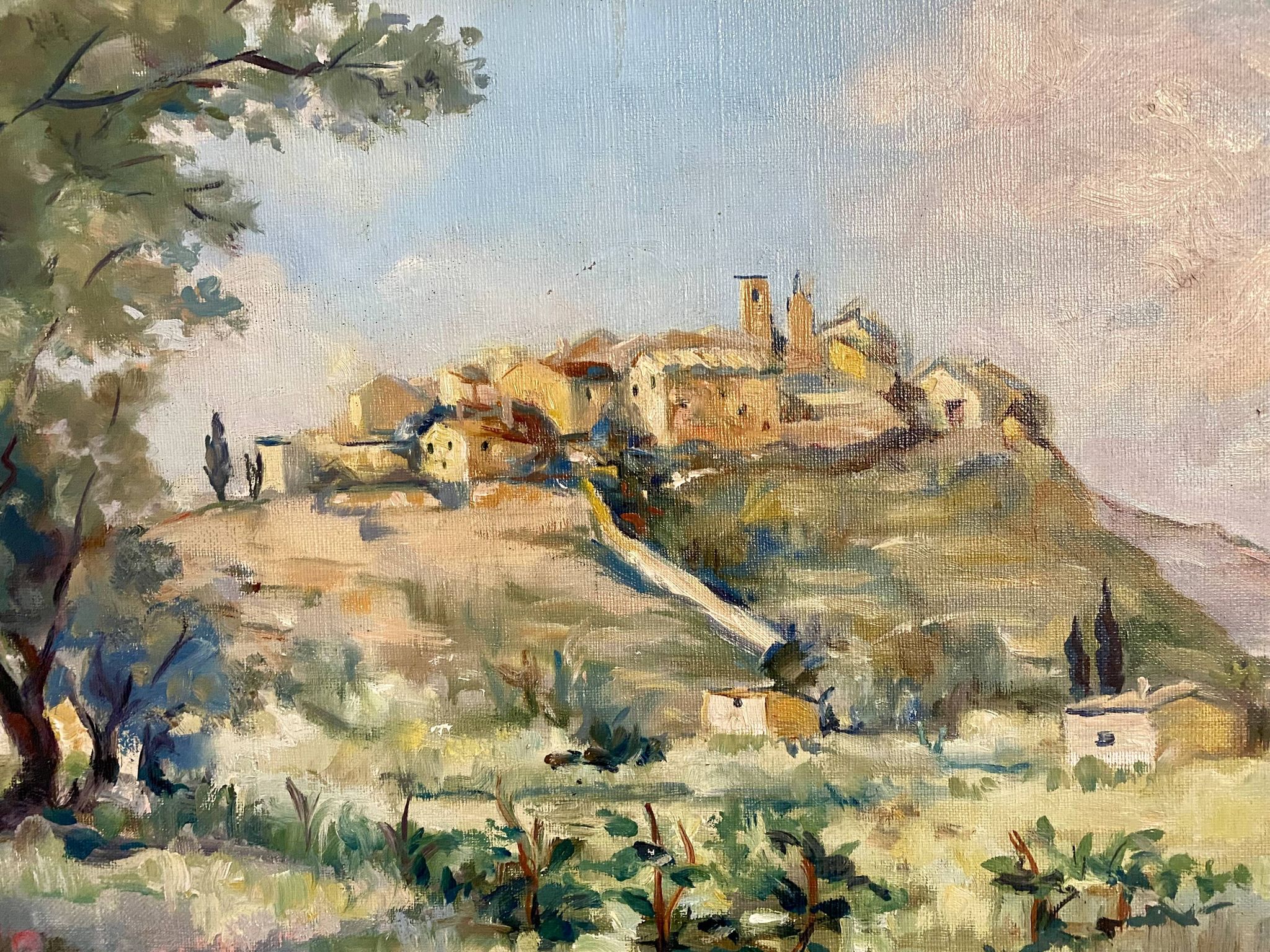 A painting representing a village in Tuscany.