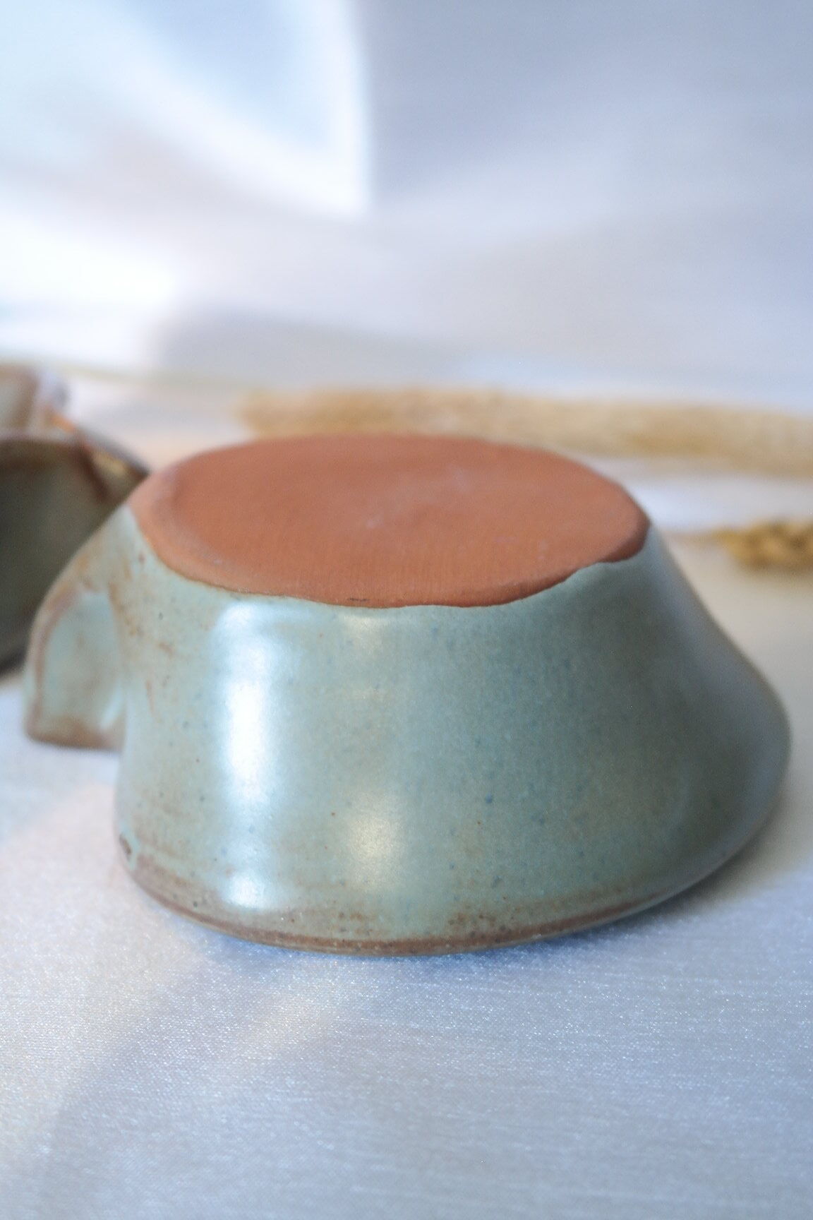 Pair of cellar rat candle holders in glazed sandstone