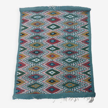 Blue kilim rug with hand-woven geometric patterns