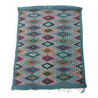 Blue kilim rug with hand-woven geometric patterns