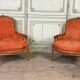 Pair of transitional carved wooden armchairs, 18th century