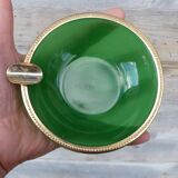 Green glass ashtray set in gold brass