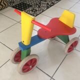 Colourful wooden 4-wheeled cycle. End of the 1970s.