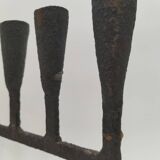 Brutalized wrought iron candle holder