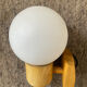Vintage wall light in solid beech and opaline from the 70s-80s.