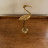 Pink flamingo in golden brass