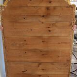 Large 19th-century wooden and gilt-studded mirror decorated with a cornucopia motif.