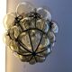 Blown glass and metal lantern
