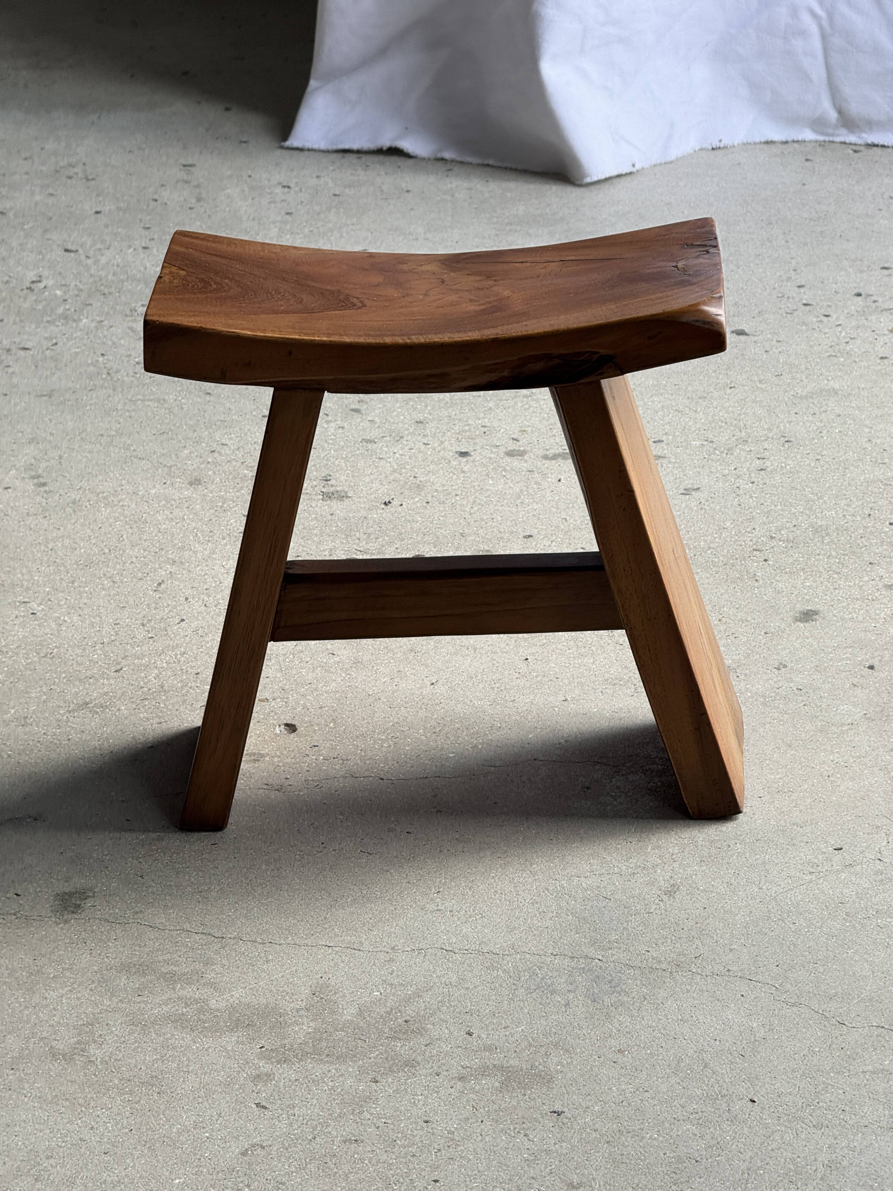 Small stool with a curved seat in Asian teak H36 W21