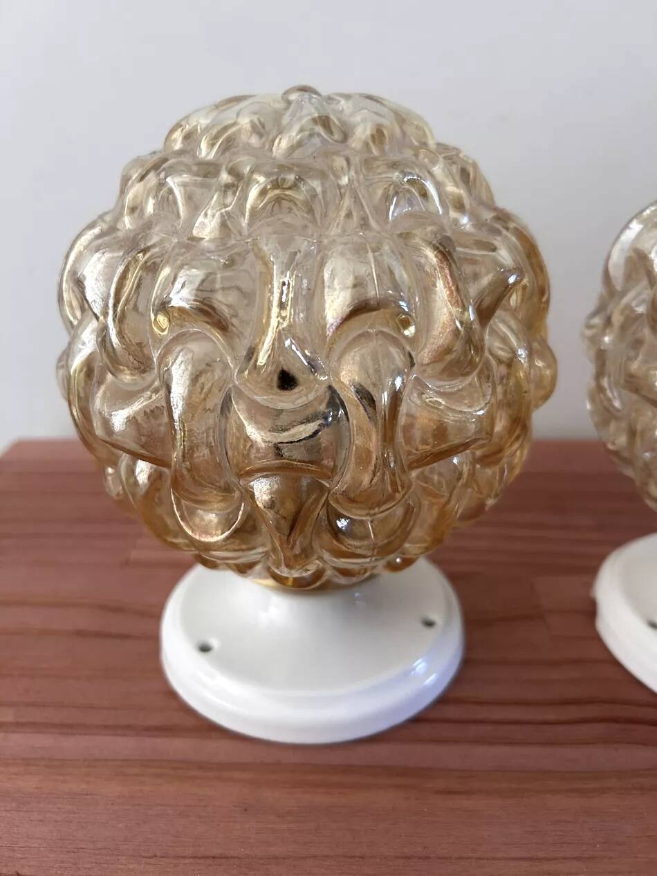 Pair of gold glass globe wall lights