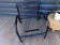 Duo of black armchairs "grilling" metal