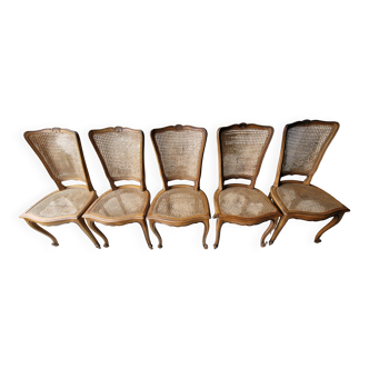 5 old cane-seated solid oak chairs.