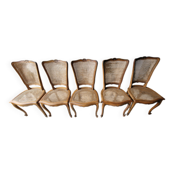 5 old cane-seated solid oak chairs.