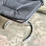 2 chairs in chromed metal and black woven skaï 1970s