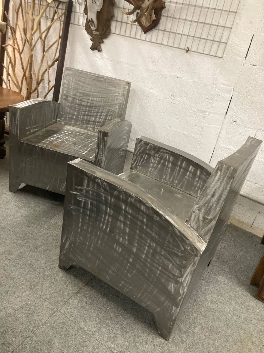 Pair of industrial metal armchairs