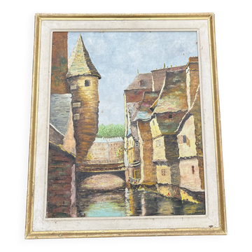 Tableau ancien – Scène de village médiéval au bord de l’eau signée