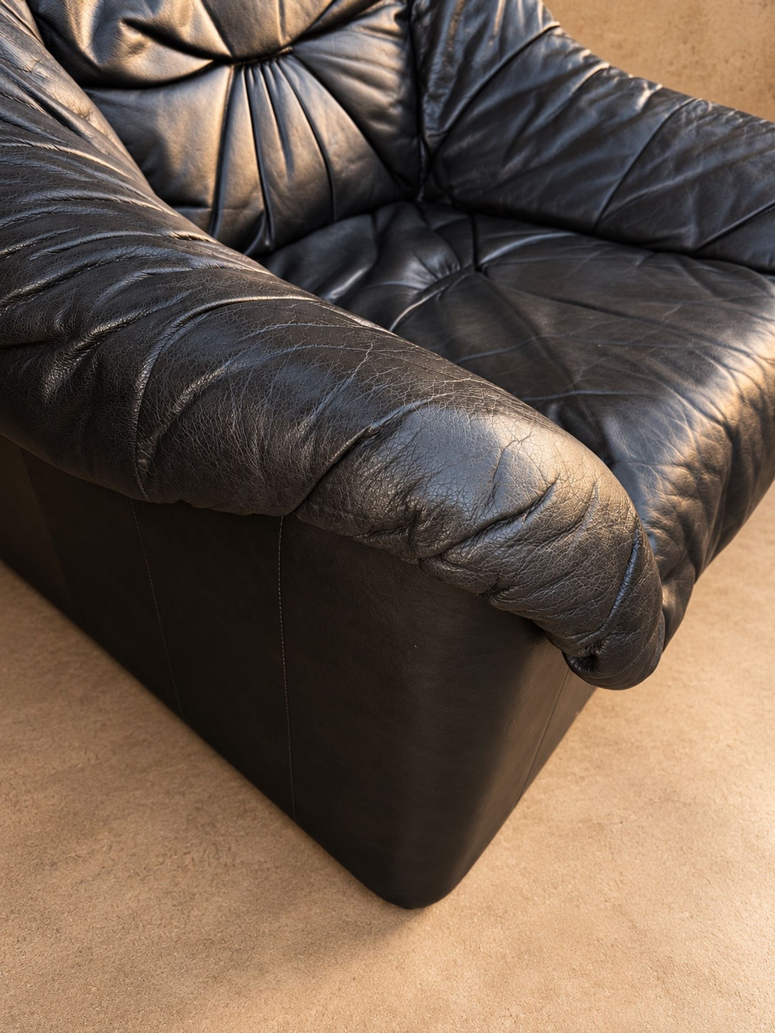 Leather armchairs and matching pouf, Italy, circa 1980
