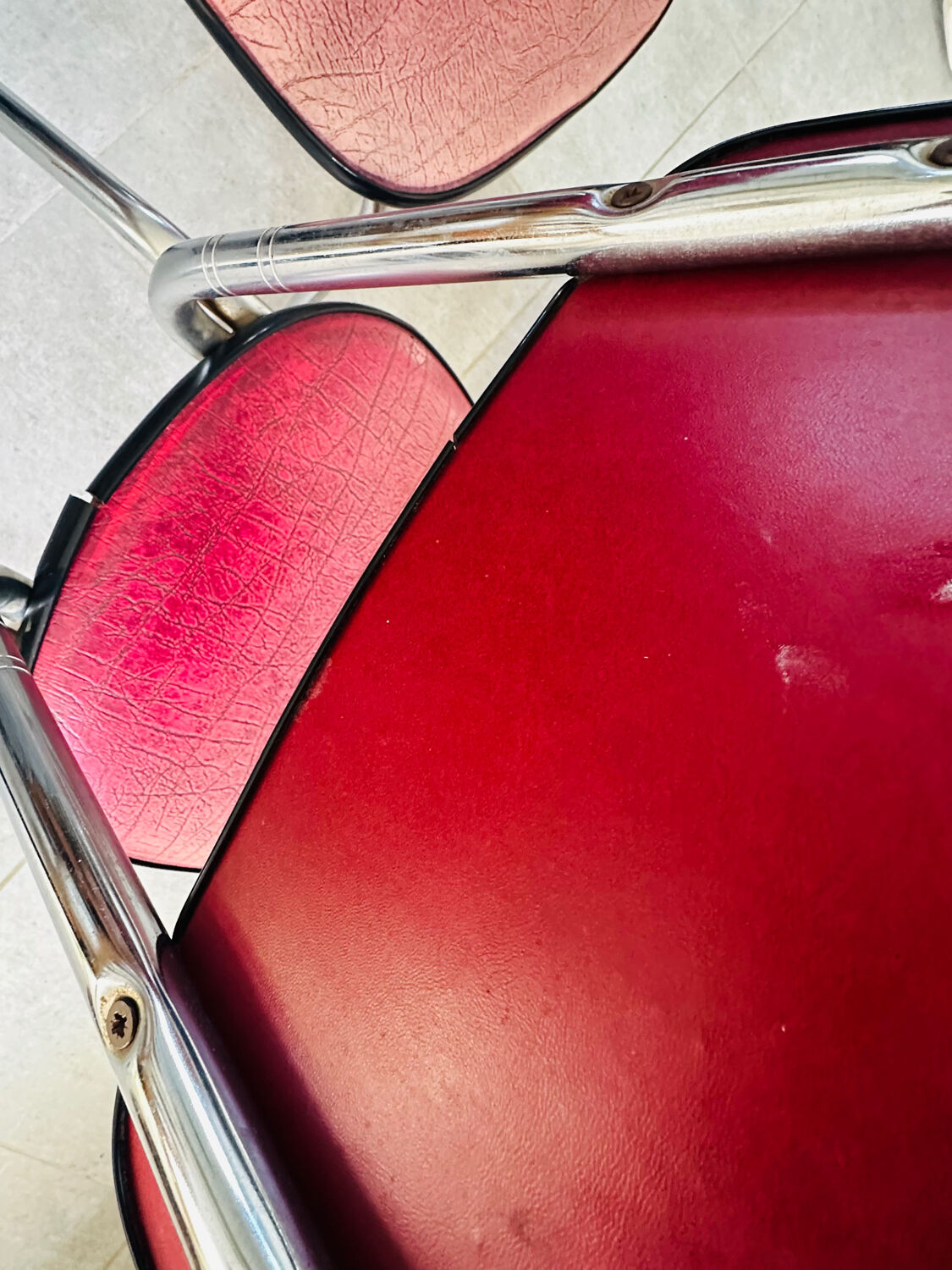 Pair of raspberry-colored chairs from the 60s/70s with metal legs