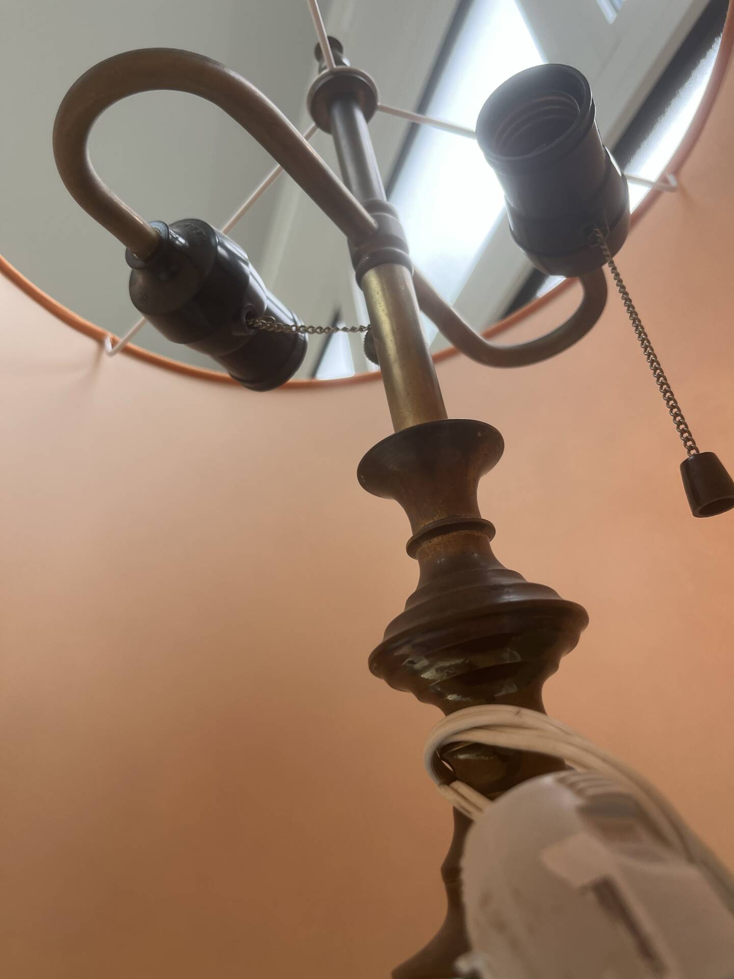 Brass floor lamp with an Orientalist wooden base.
