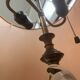 Brass floor lamp with an Orientalist wooden base.