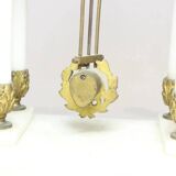 Clock and pair of Louis XVI style candelabras.