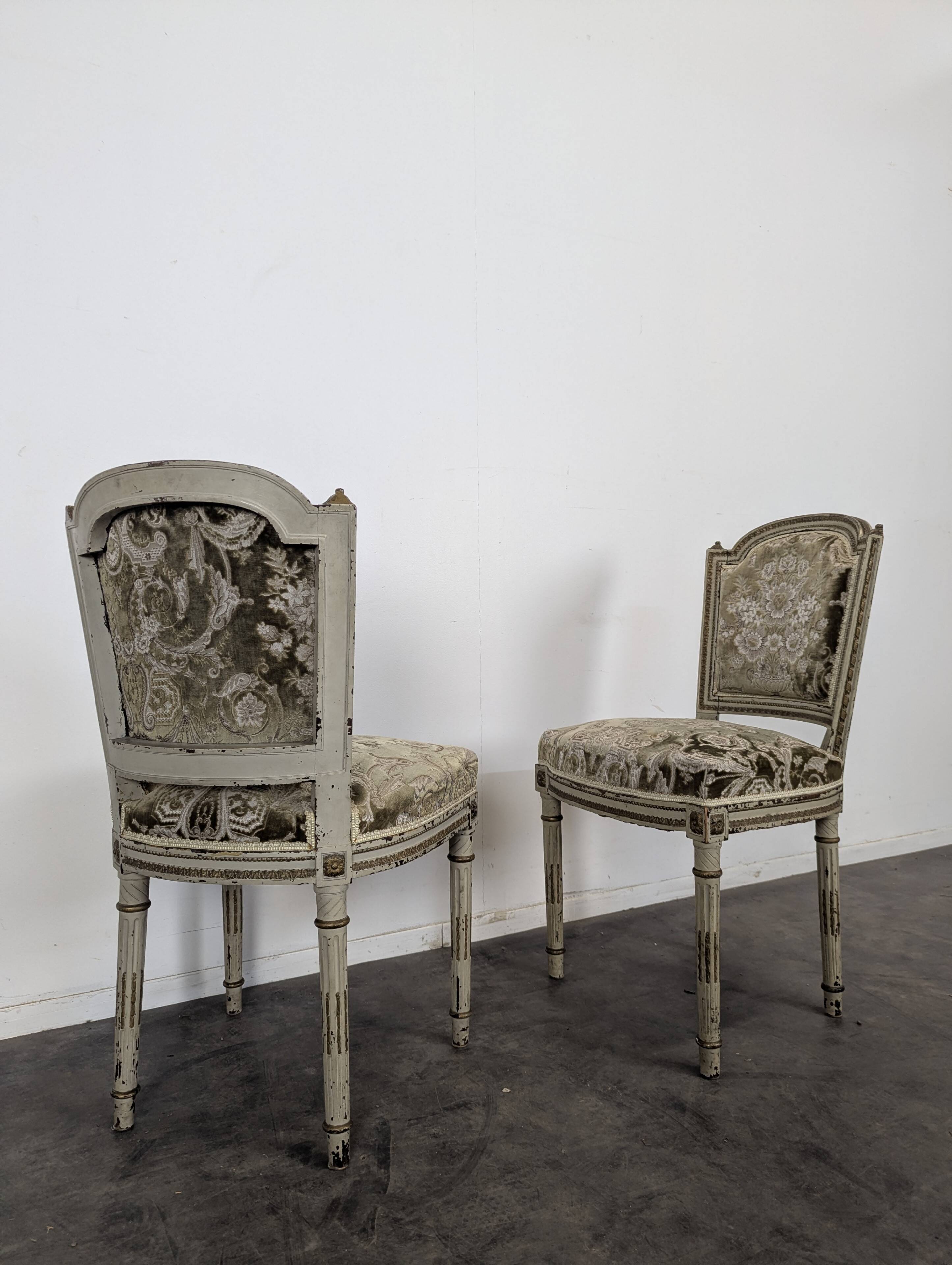 Cream lacquered Louis XVI style cabriolet salon with gold highlights.
