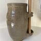 Old varnished stoneware pickle pot with tongs