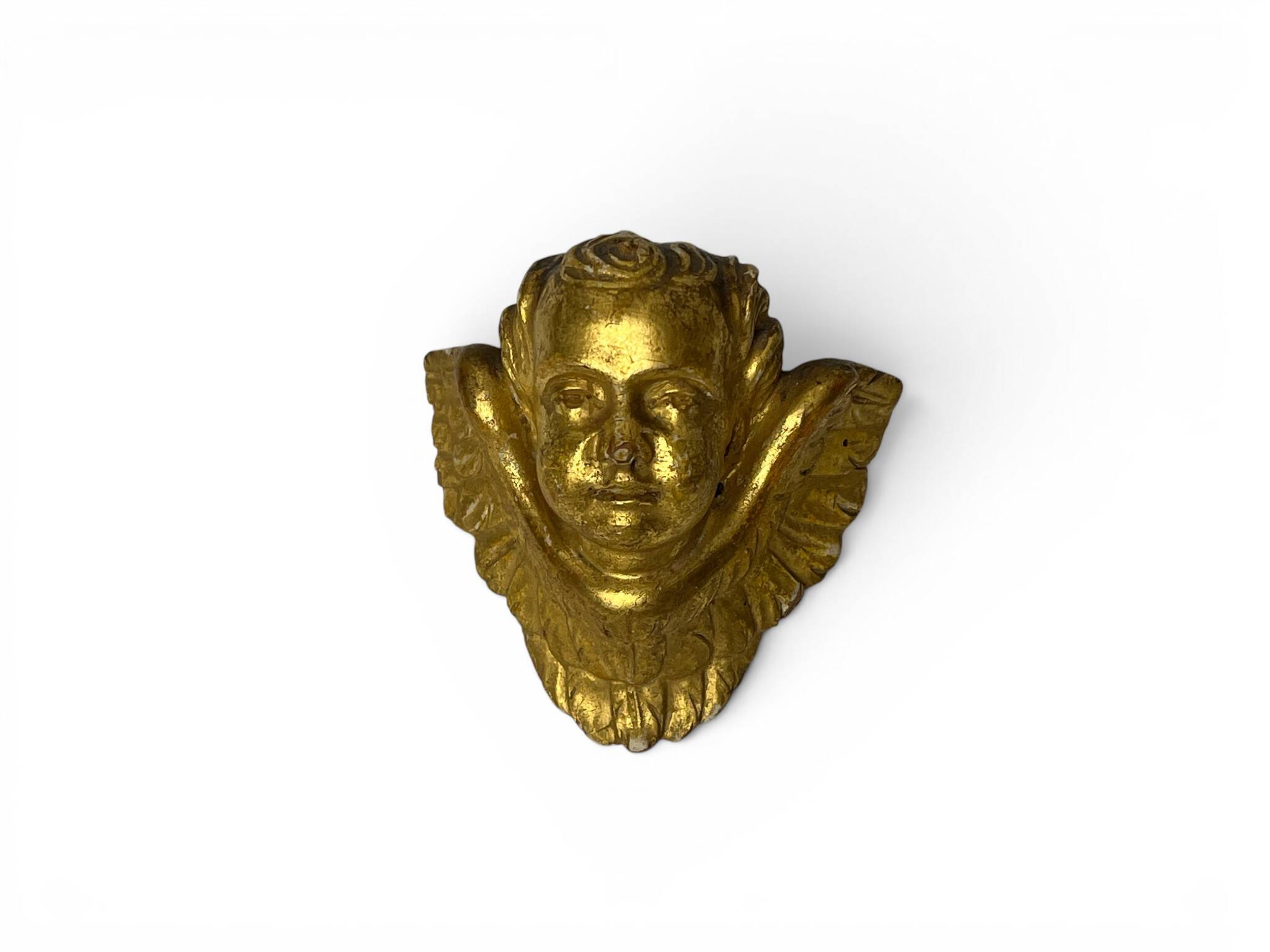 Antique cherub head in gilded wood from the early 20th century.