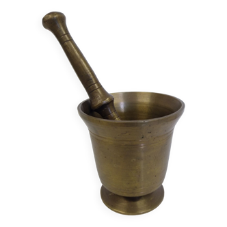 Old bronze apothecary mortar with pestle