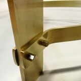 Table basse années 70  forme libre laiton et verre