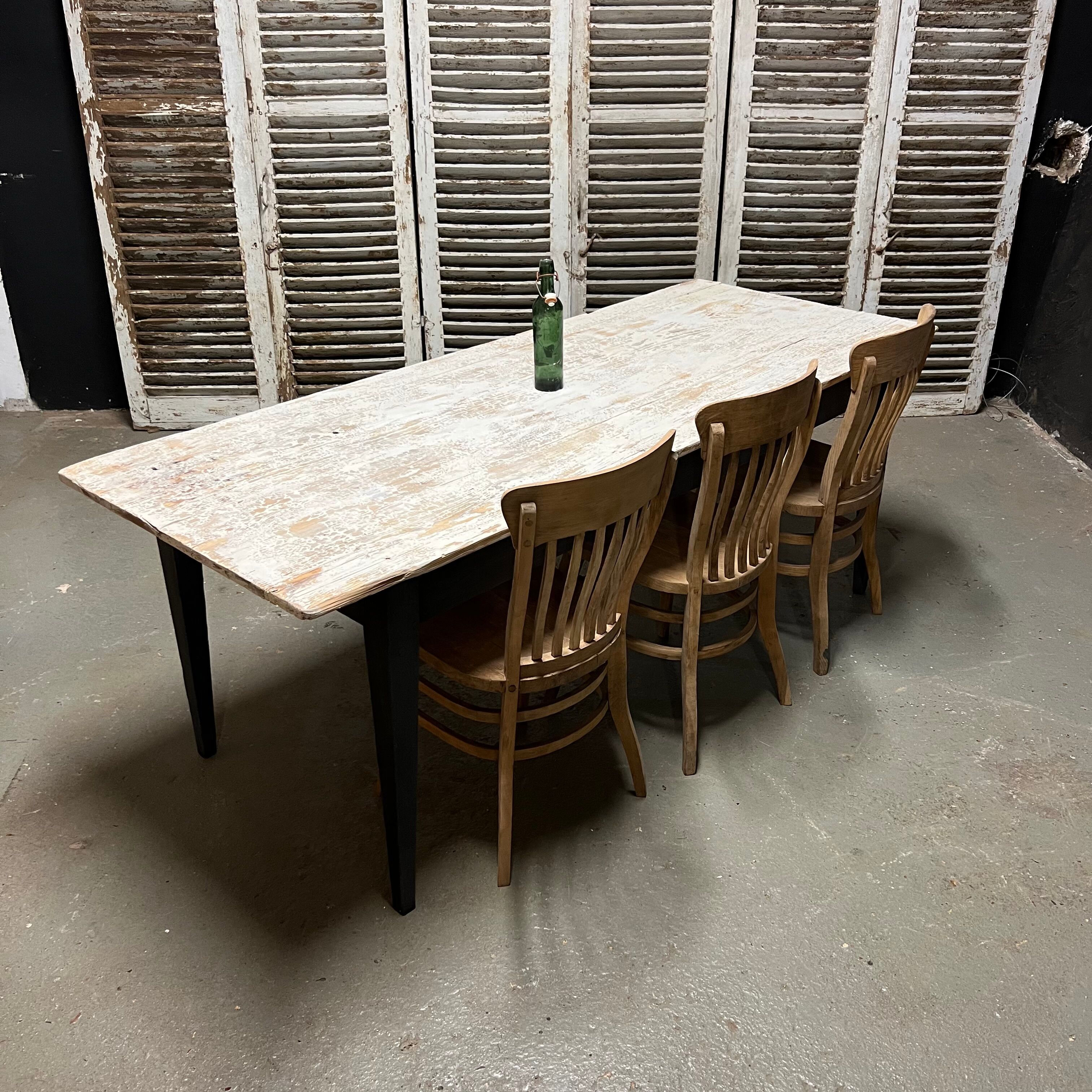 Black farmhouse table and white patinated top