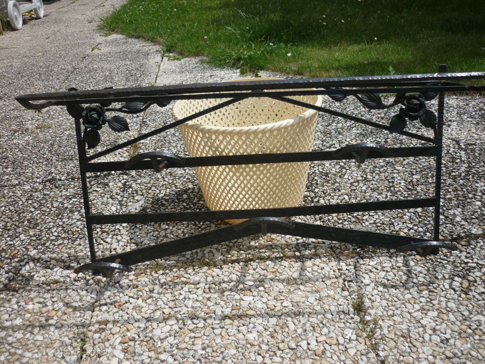 Wrought iron vest and a shelf with a hat