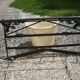 Wrought iron vest and a shelf with a hat