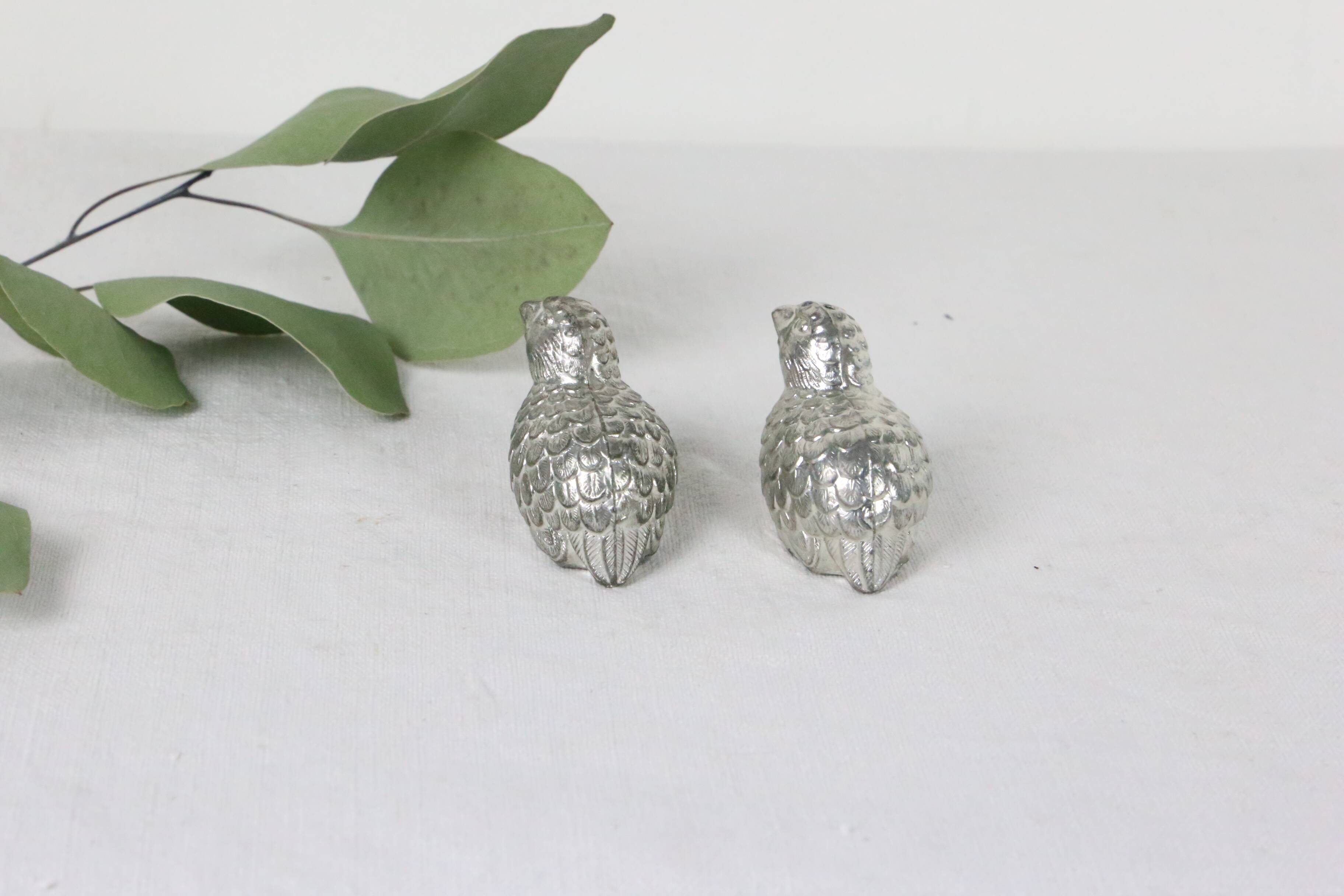 Metal salt and pepper shakers depicting two quails, 1970