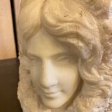 Sculpture woman face in marble block 1900