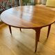 Extendable round table in solid walnut, 125cm in diameter, 5 extensions.