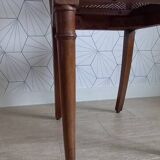 Chaise cannée art déco avec ornements en bronze.