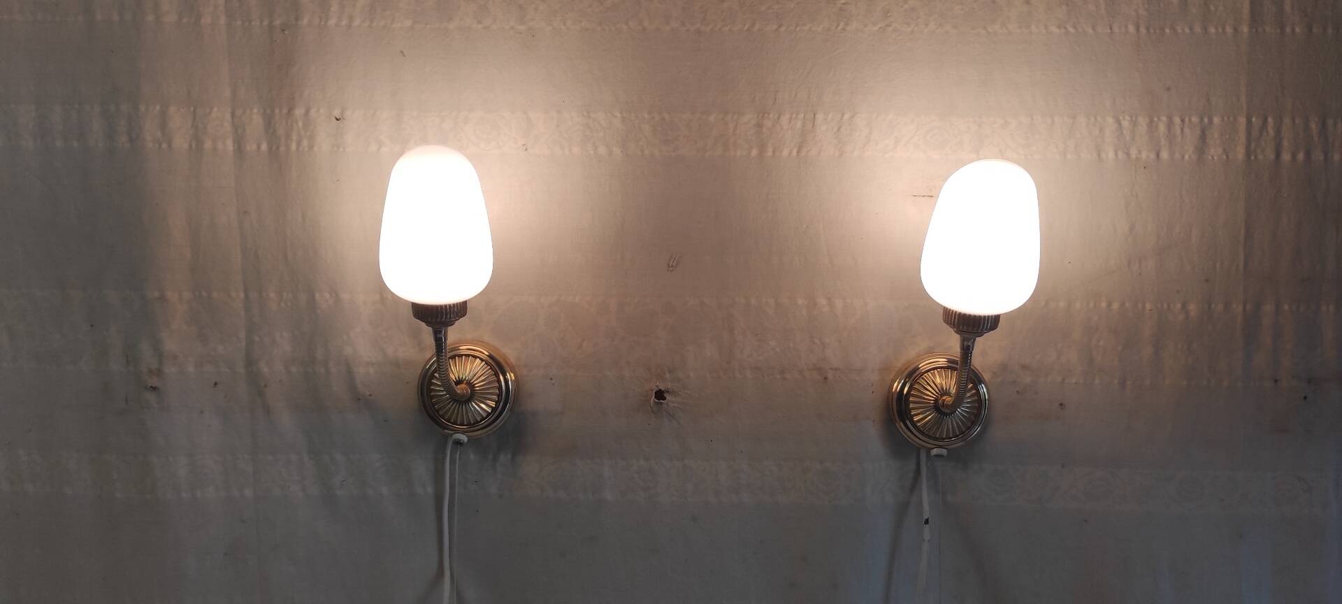 Articulated brass and opaline wall lights - mid 20th century.
