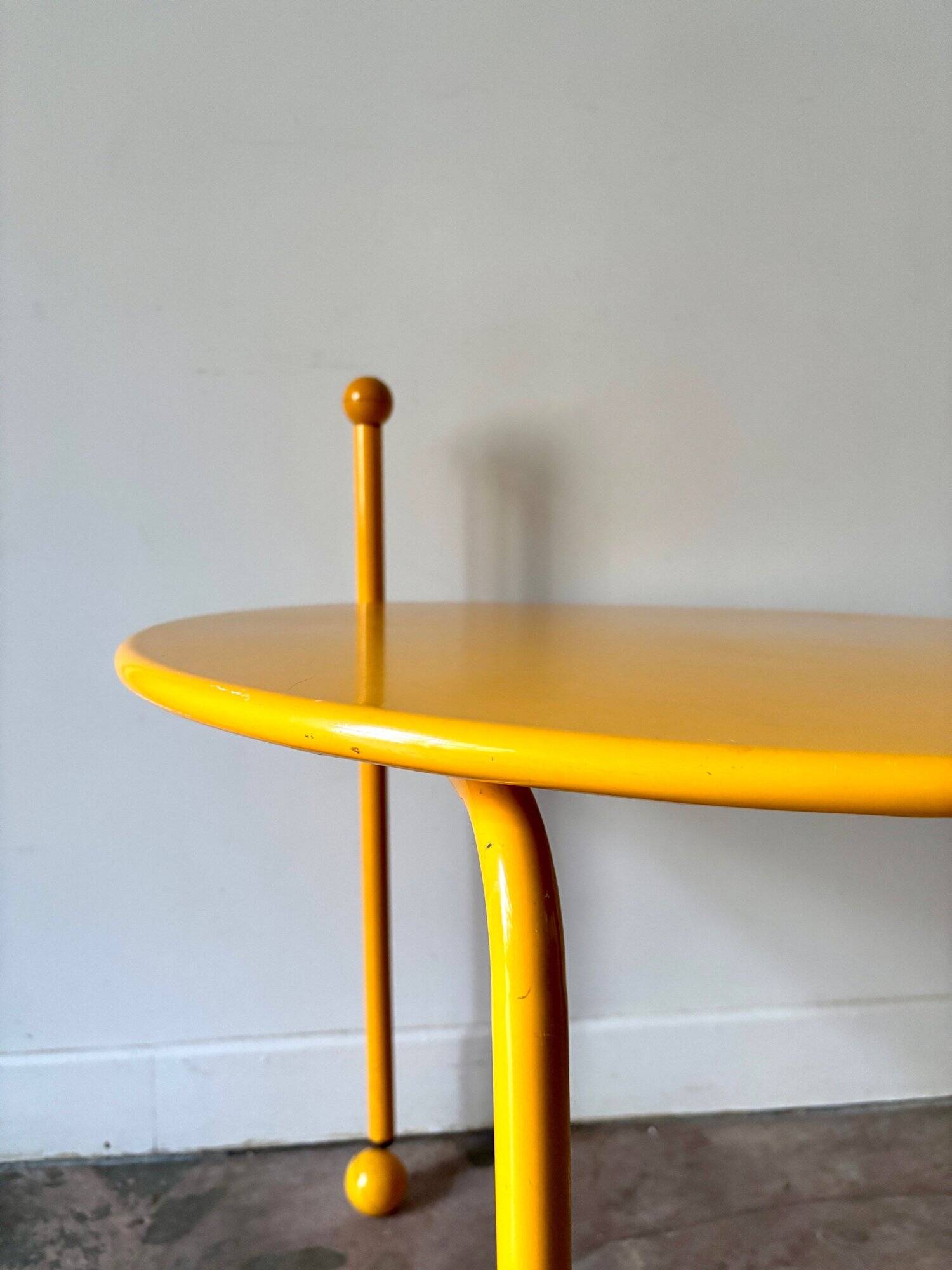 Yellow metal tripod coffee table by Tord Bjorklund for Ikea, circa 1980