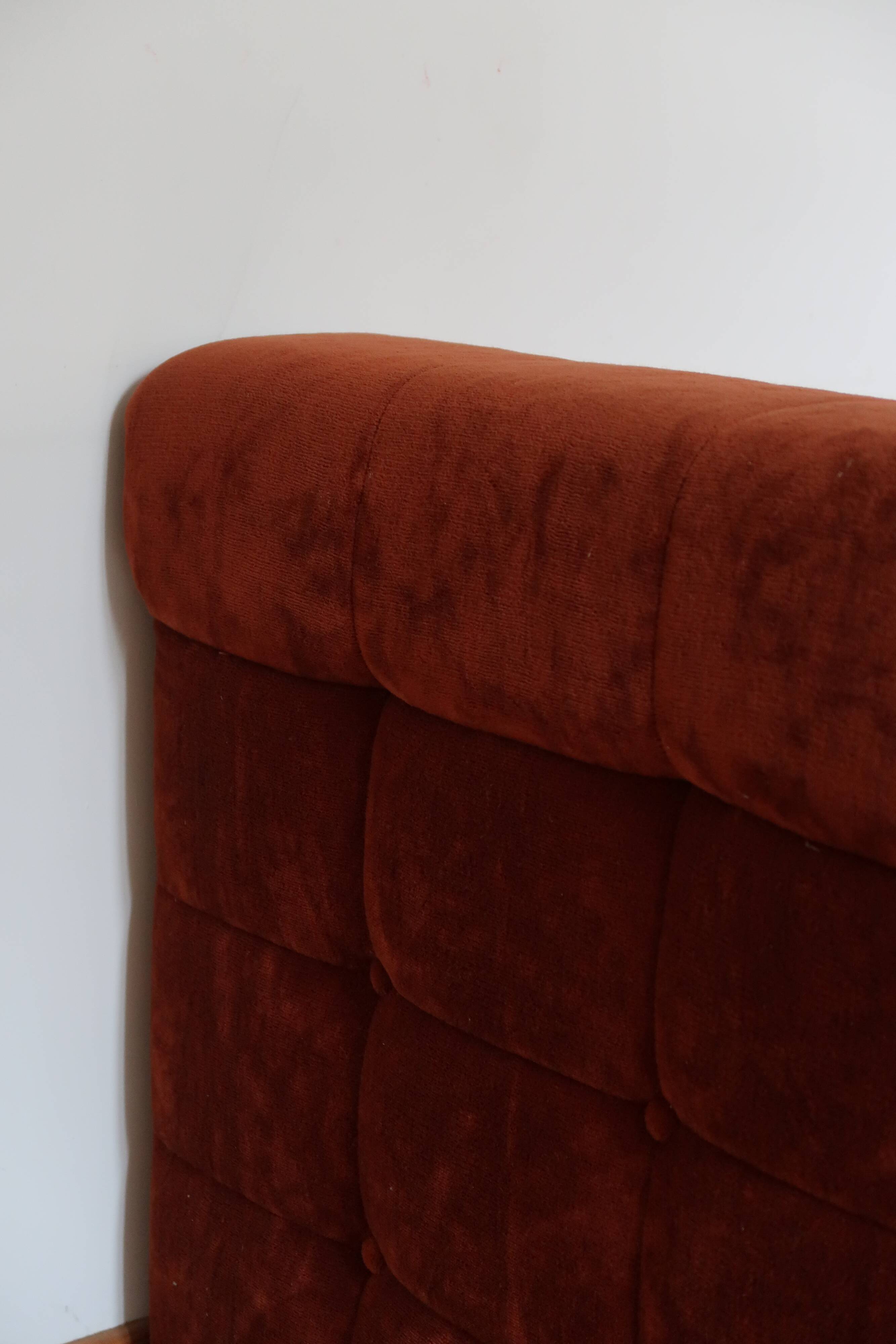 Rusty velvet low chair without arms