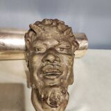 Head of satire in plaster